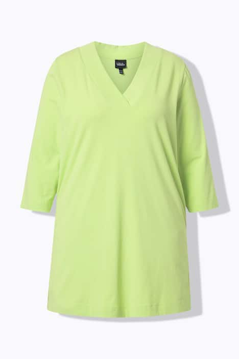 T-shirt long, coupe évasée. Décolleté en V et manches 3/4