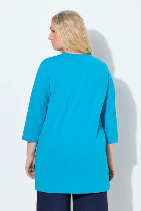 T-shirt long, coupe évasée. Décolleté en V et manches 3/4