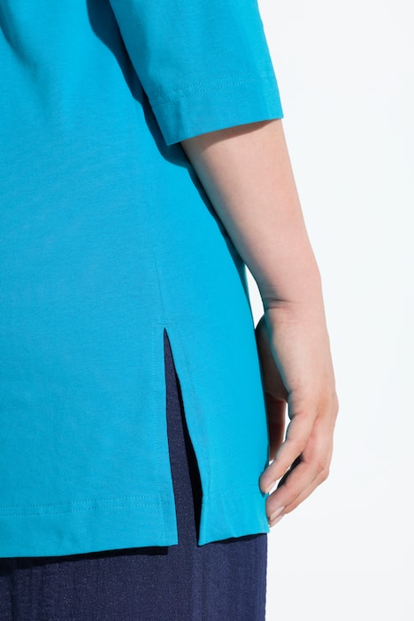 T-shirt long, coupe évasée. Décolleté en V et manches 3/4