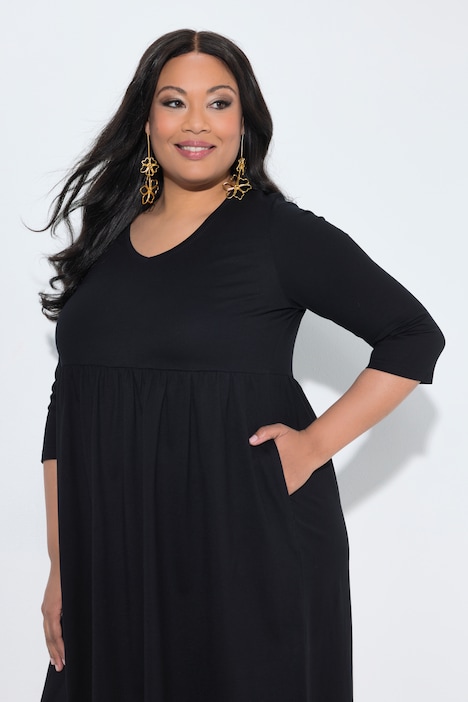 Robe en jersey avec poches, couture empire, décolleté en V et manches 3/4