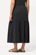 Jupe en jersey texturé. Coupe évasée et volant. Taille élastique