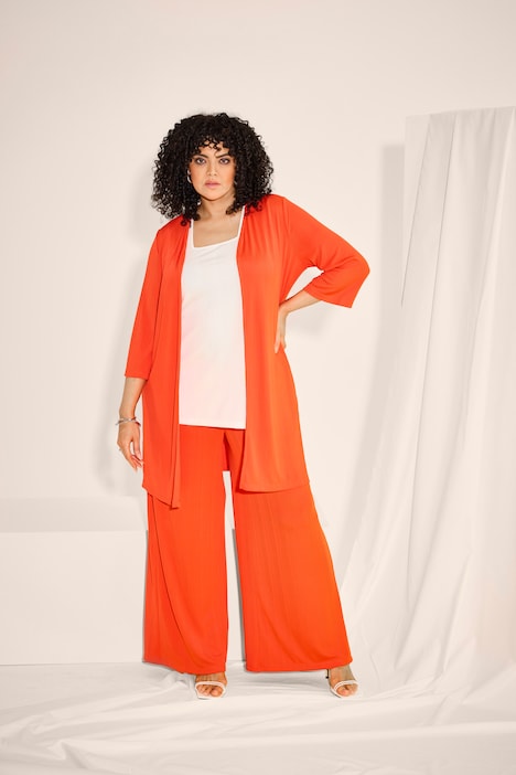 Gilet long en jersey côtelé. Coupe ouverte et encolure en V