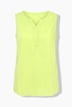 Blouse sans manches, col tunisien et base arrondie