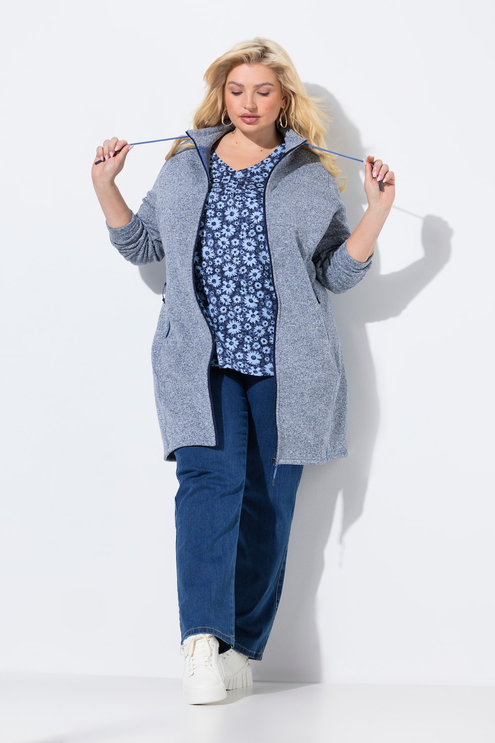 Jas van gebreide fleece, opstaande kraag, langer model, ritszakken