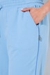 Pantalon de jogging, taille et bas de jambe élastiques, passepoil sur les côtés