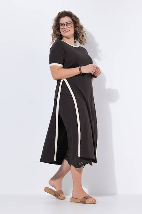 Top lungo con bordi decorativi, scollo a barca