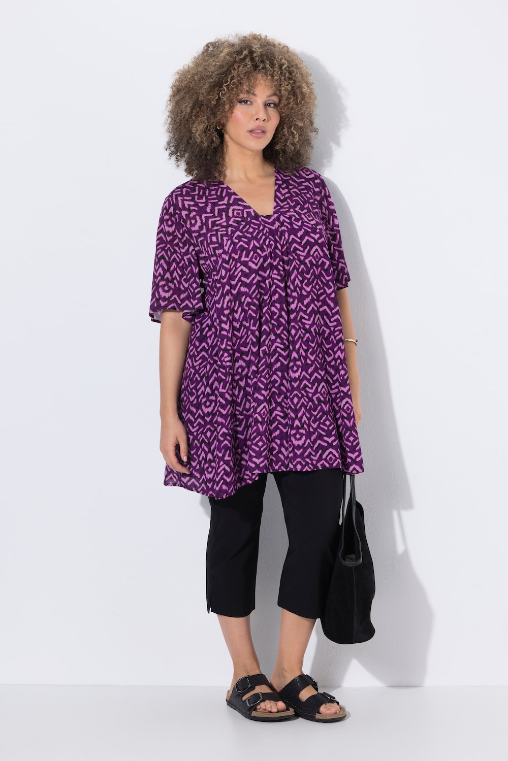 Bluse med dekorative folder