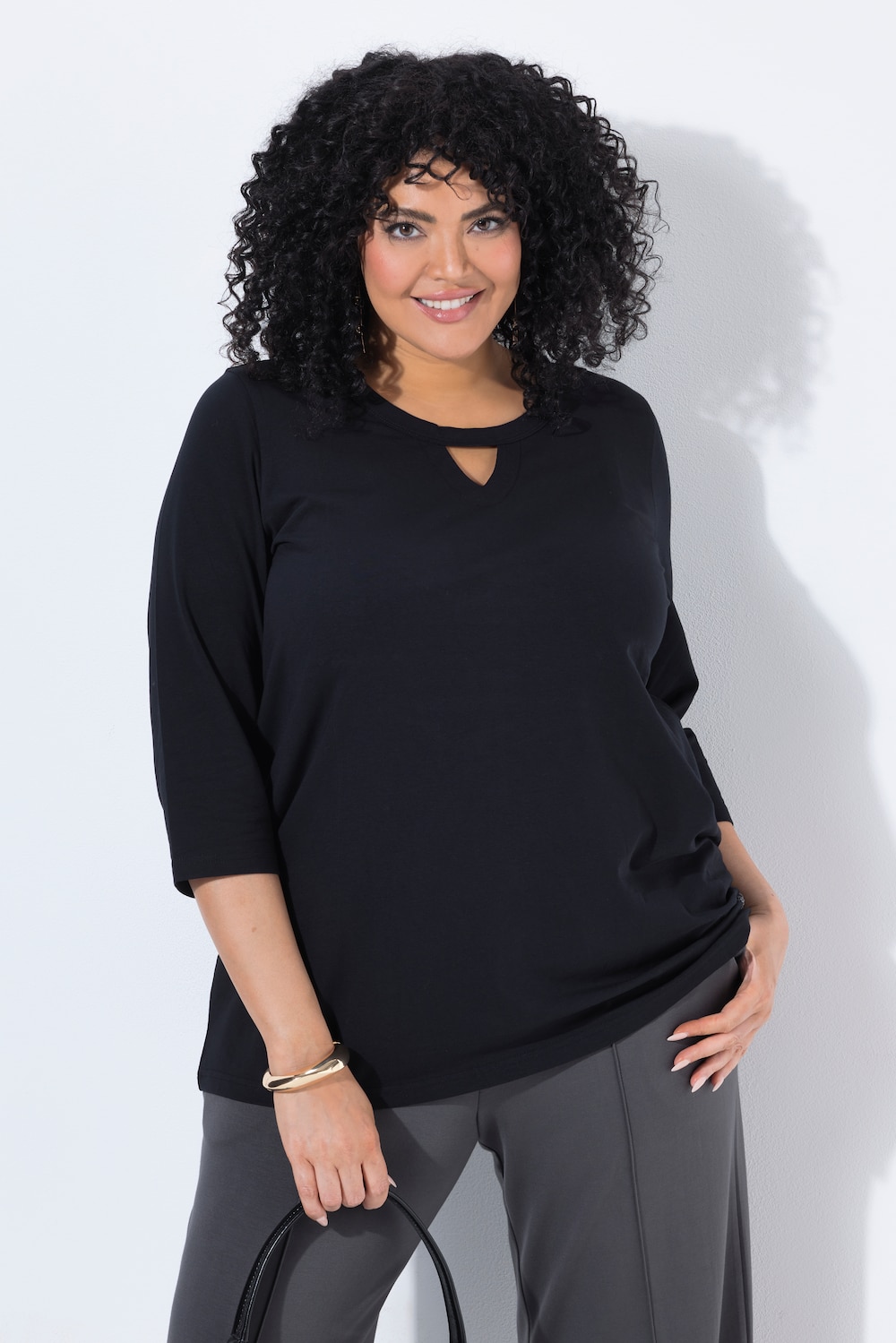 Bluse i A-linje med glittermotiv, nøglehul, rund hals og 3/4-ærmer