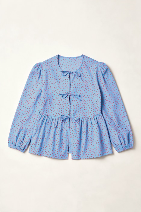 Blouse coupe confortable, se ferme à l’aide de petits rubans, manches gigot