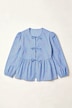 Blouse coupe confortable, se ferme à l’aide de petits rubans, manches gigot