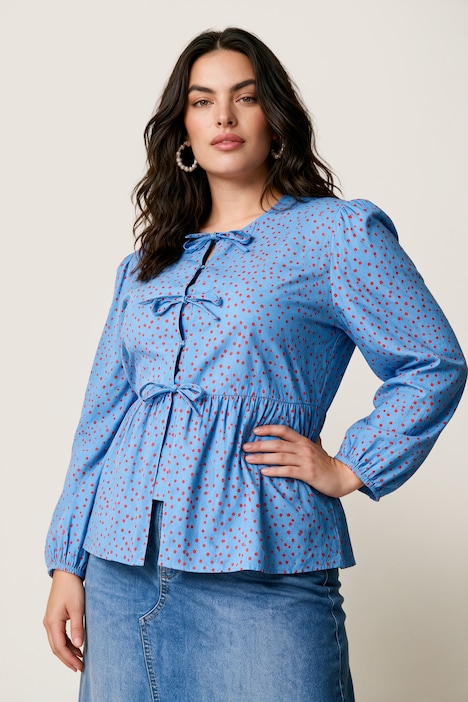 Blouse coupe confortable, se ferme à l’aide de petits rubans, manches gigot