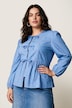 Blouse coupe confortable, se ferme à l’aide de petits rubans, manches gigot