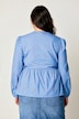 Blouse coupe confortable, se ferme à l’aide de petits rubans, manches gigot